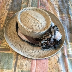 Straw hat with braided ribbon trim